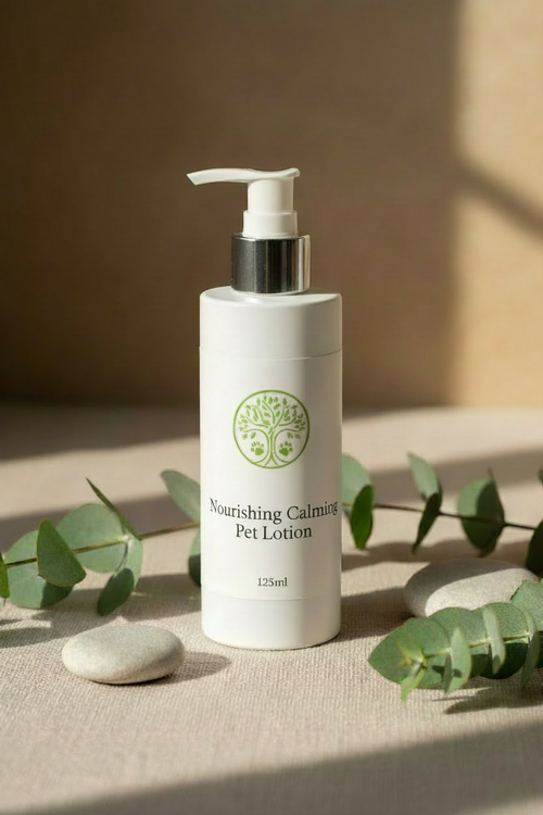LAPA Nourishing Calming Pet Lotion 125ml pump bottle on natural linen with eucalyptus leaves and smooth stones